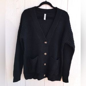 New cardigan sweater. Black, with tortoise colored buttons.